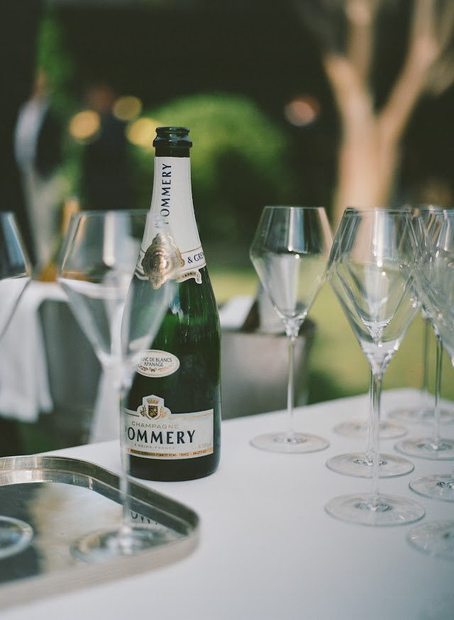 Pommery Champagne and rows of glasses on white linen