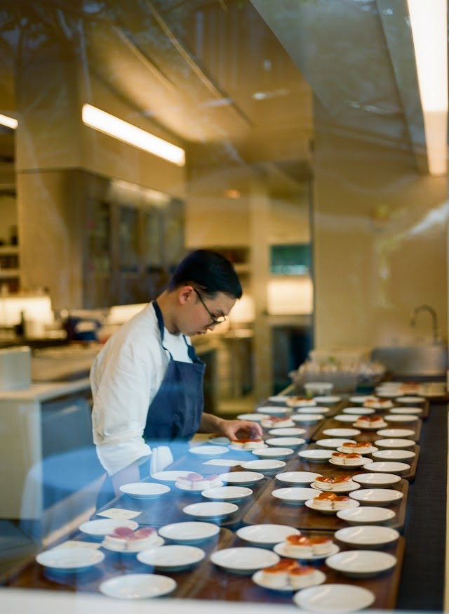 The kitchen plating canapes before service