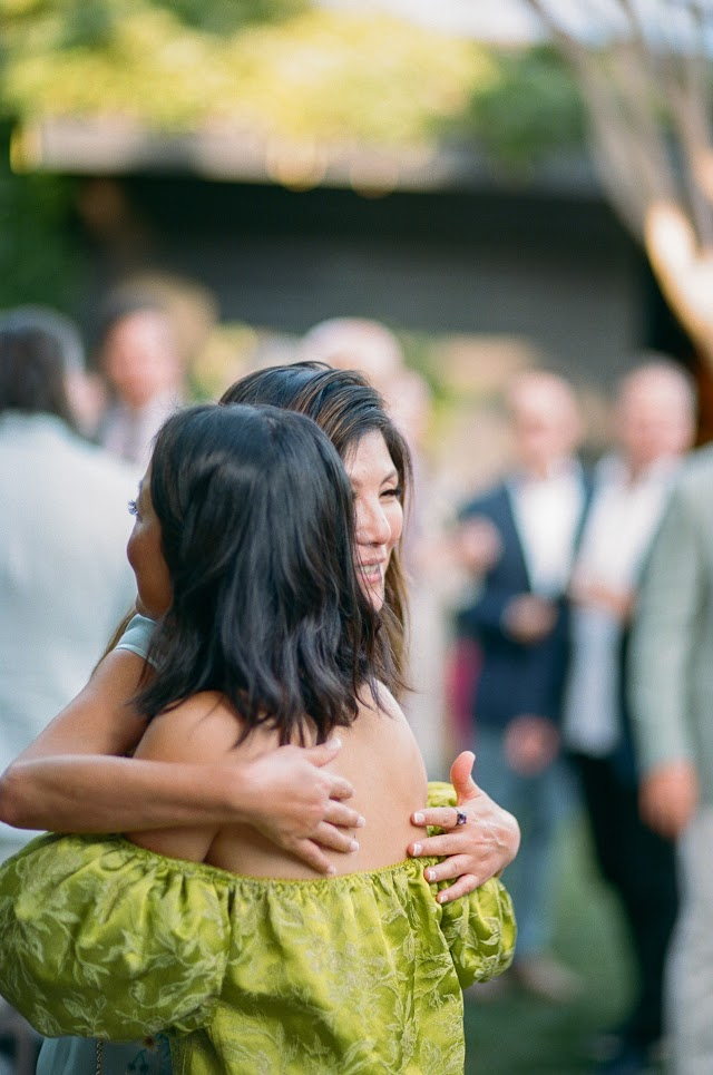 Old friends embracing on the lawn