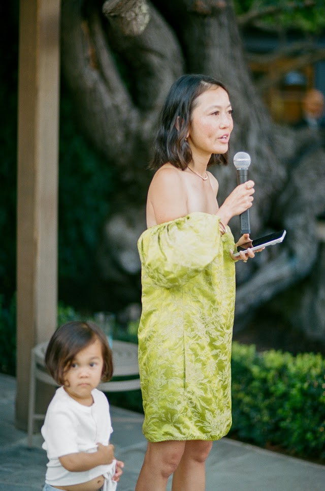 The evening's host offering a toast, microphone in hand