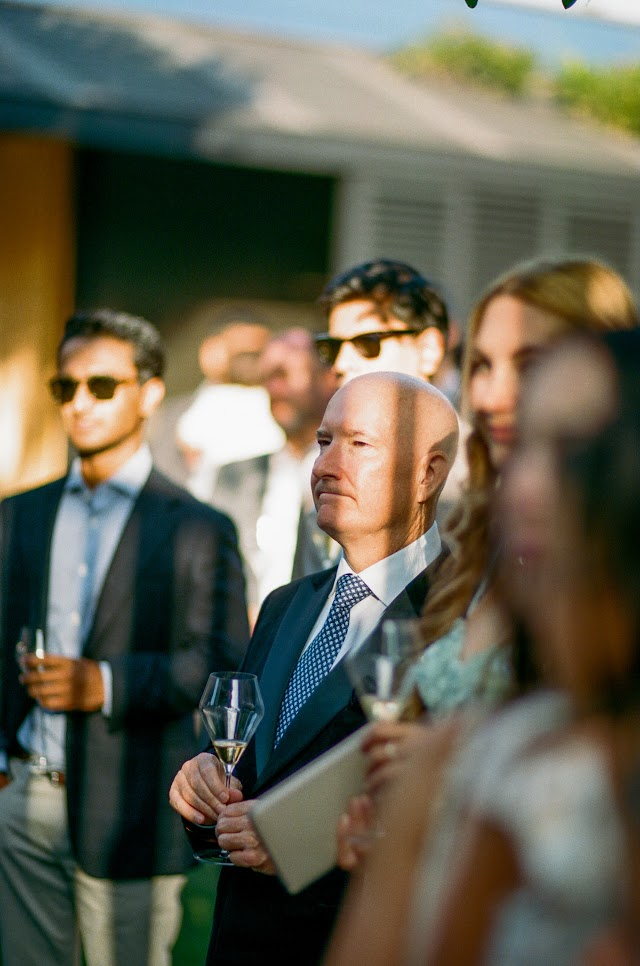 A guest follows the toast, notes in hand