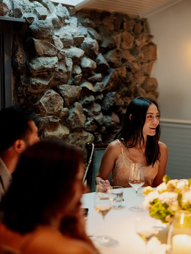 A toast between neighbors at the table