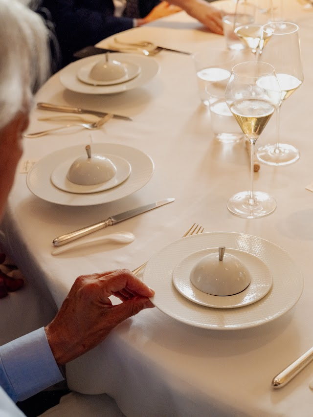 Cloched plates set down in unison